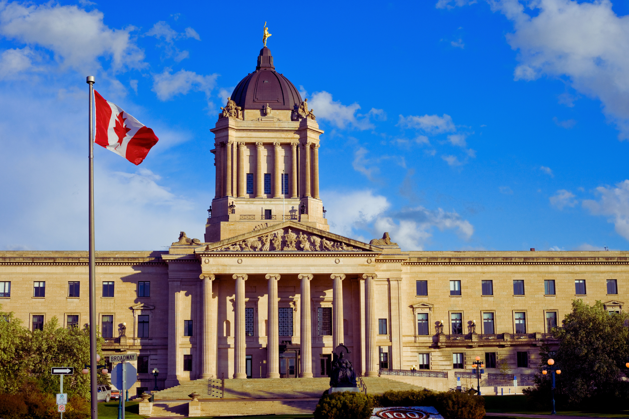Building with flag in canada somewhere - constric consultants